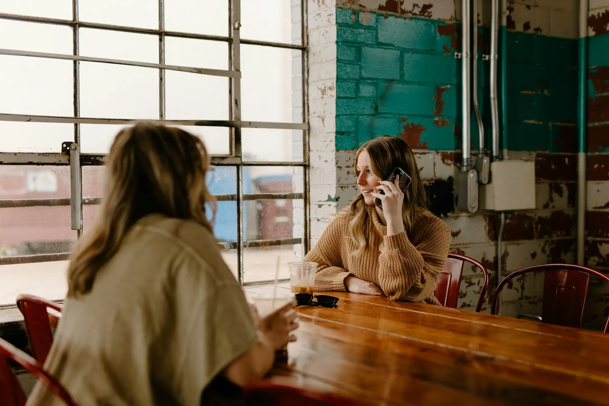 Accountant meeting a business owner at a cafe table